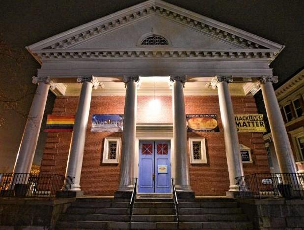 The Unitarian Society of Northampton and Florence (USNF) building at night.
